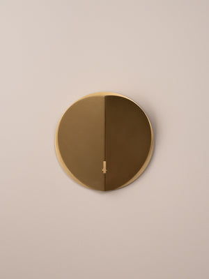 Folded wall sconce shown in natural brass finish, front view