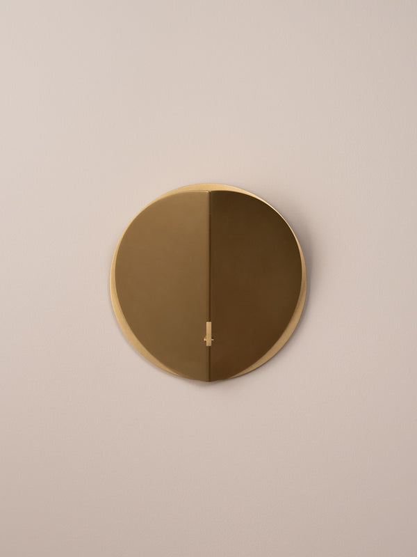 Folded wall sconce shown in natural brass finish, front view