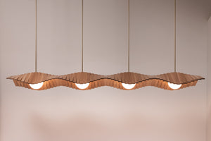 Wave IV chandelier shown in natural oak and natural brass finishes, front view, illuminated